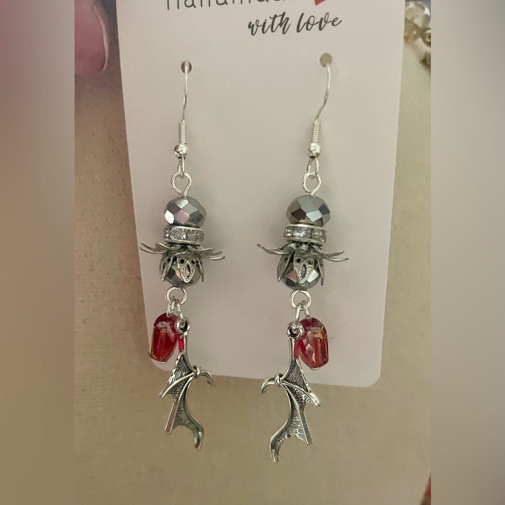 2 for $10. Silver and Red Dragon Wing Earrings